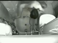 The naughty wife vigorously masturbates in front of the concealed camera in the restroom.